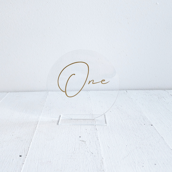 Round Perspex table number - Clear/Gold - <p style='text-align: center;'><b>HOT NEW ITEM</b><br>R 35</p>